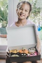 Girl holding Colorful Halloween donut set box