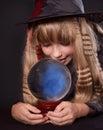 Girl holding crystal ball.