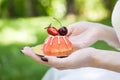 Girl holding cupcake decorated with berries Royalty Free Stock Photo