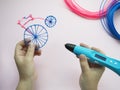 A girl is holding 3d pen and retro bike made of plastic