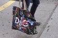A girl holding a Dolce and Gabbana bag