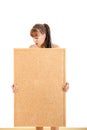 Girl holding empty board with advertising space for message Royalty Free Stock Photo