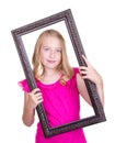 Girl holding frame around face Royalty Free Stock Photo