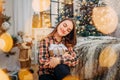 Girl holding a gift box and enjoying Christmas time Royalty Free Stock Photo