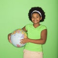 Girl holding globe.