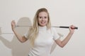 Girl holding golf club Royalty Free Stock Photo