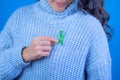 Girl holding green ribbon in support of liver and adrenal cancer, Text with the legend \