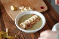 Girl holding a green smoothie bowl. vegans