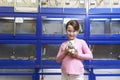 Girl Holding Guinea Pig In Pet Store Royalty Free Stock Photo