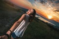 Girl holding a guy`s hand having good times in nature