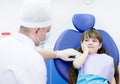 girl holding her cheek with a toothache at dentist Royalty Free Stock Photo