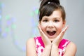 Girl is holding her face in astonishment Royalty Free Stock Photo