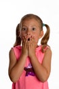 Girl holding her hands over her mouth Royalty Free Stock Photo