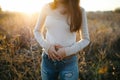 Girl holding her stomach in pain, suffering from stomach pain