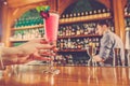 The girl is holding in his hand a glass of alcoholic beverage Royalty Free Stock Photo