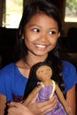 Girl holding homemade doll Royalty Free Stock Photo