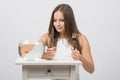 Girl holding knife and fork in hand and with an appetite for looking at the little goldfish Royalty Free Stock Photo