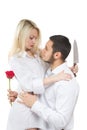Girl holding knife traitor. man with rose in his