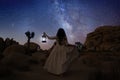 Girl Holding Lantern in the Desert Under the Milky Way