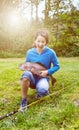 Girl holding large salmon trout fish during bright summer day Royalty Free Stock Photo