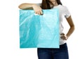 Girl holding a light blue plastic bag. Close up. Isolated background Royalty Free Stock Photo
