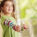 Girl holding light bulb Royalty Free Stock Photo