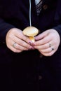 The girl is holding a little mushroom. Dark background