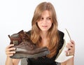 Girl holding male and female shoe