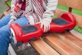 Girl holding modern red electric mini segway or hover board scooter Royalty Free Stock Photo