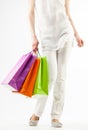 Girl holding multicolored shopping paper bags Royalty Free Stock Photo