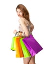 Girl holding multicolored shopping paper bags Royalty Free Stock Photo