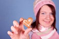 Girl holding one heart cookie