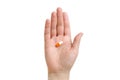 Girl holding an orange capsule. Isolated on white background