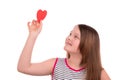 Girl holding a paper heart in hand Royalty Free Stock Photo