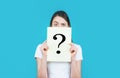 Girl holding paper question mark. Anonymous, woman question, incognita. Anonymous woman. Female incognita.Girl question Royalty Free Stock Photo