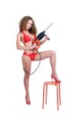 Girl holding perforator drilll and stool Royalty Free Stock Photo