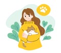 Girl holding pet cat with warm atmosphere