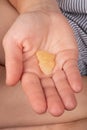 girl holding a piece of wax with a high content of THC in her hands