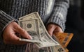 Girl holding a pile of wads of money dollar bills Royalty Free Stock Photo