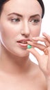 Girl holding a pill. Vitamins concept. Beautiful portrait Royalty Free Stock Photo