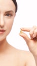 Girl holding a pill. Vitamins concept. Beautiful portrait Royalty Free Stock Photo