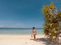 Girl on turquoise water and white beach in Camiaran island in Balabac in Philippines Royalty Free Stock Photo