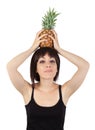 Girl holding pineapple over his head