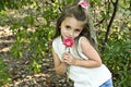 Girl holding pink flower