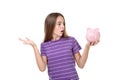 Girl holding pink piggybank Royalty Free Stock Photo