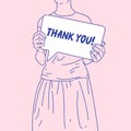 The girl is holding a poster that says thank you. A young woman stands facing the viewer. Royalty Free Stock Photo