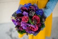 Girl holding purple and pink flower bouquet Royalty Free Stock Photo