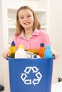 Girl Holding Recyling Waste Bin At Home