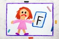 Girl holding report card with F grade. Photo of colorful hand drawing Royalty Free Stock Photo