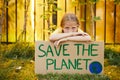 Girl Holding Save The Planet Poster